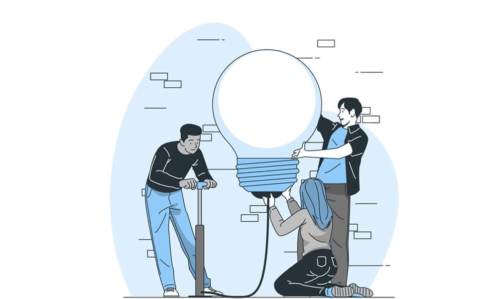 یک تیم خلاق که یک بالن به شکل یک لامپ می سازند